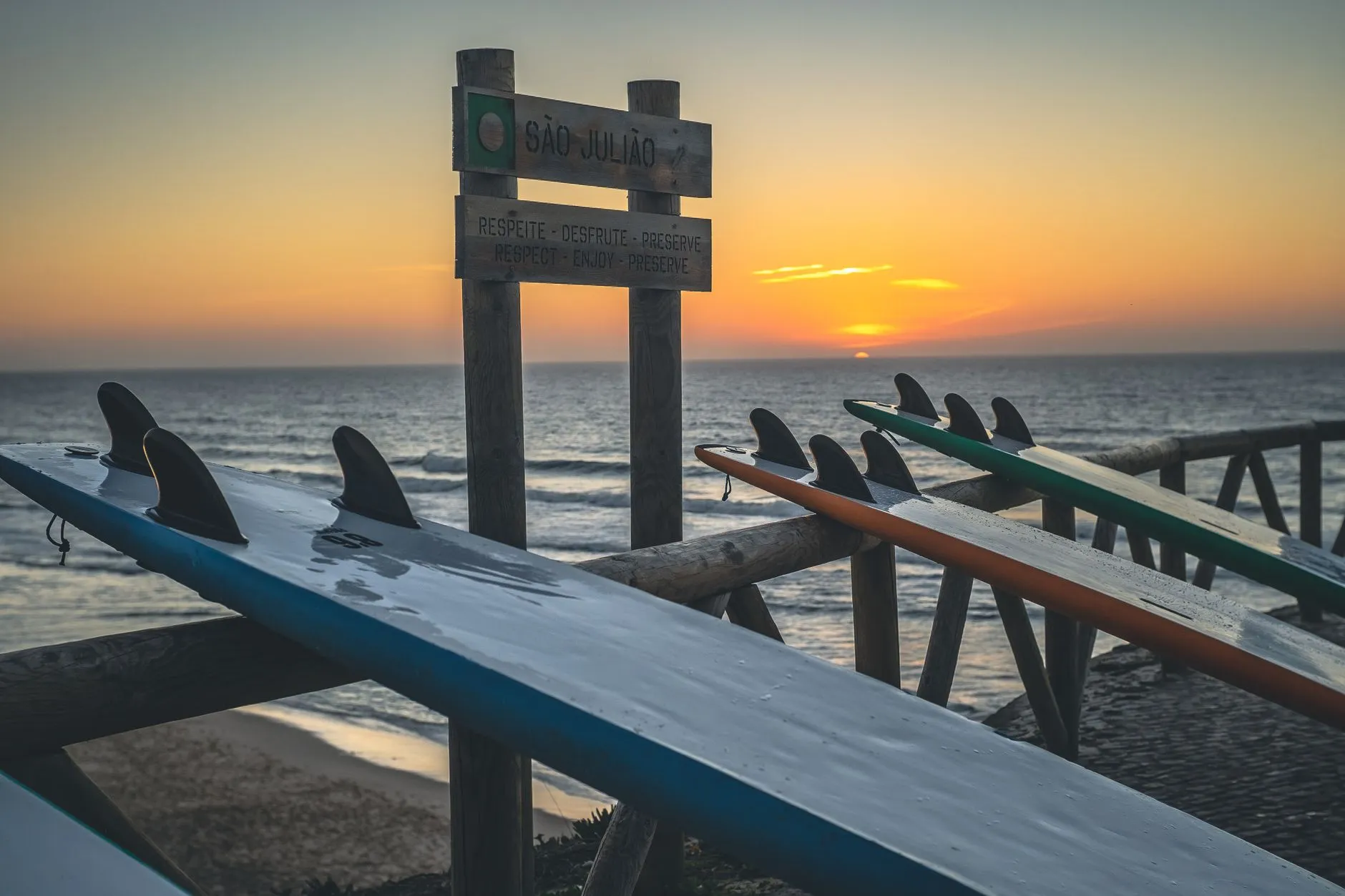 Boards resting above São Julião at sunset
