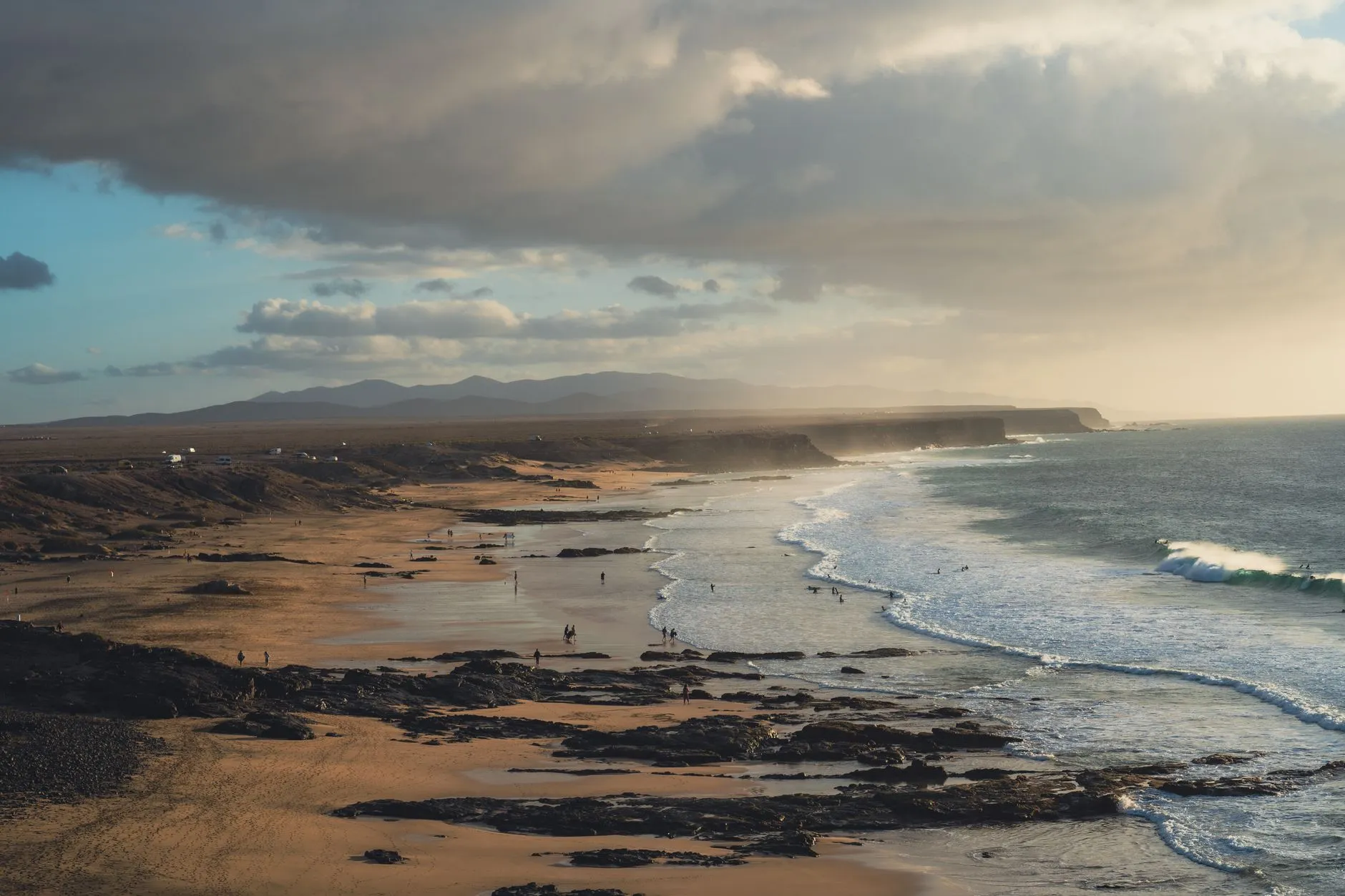 Last light on the sand and lava rock at El Cotillo