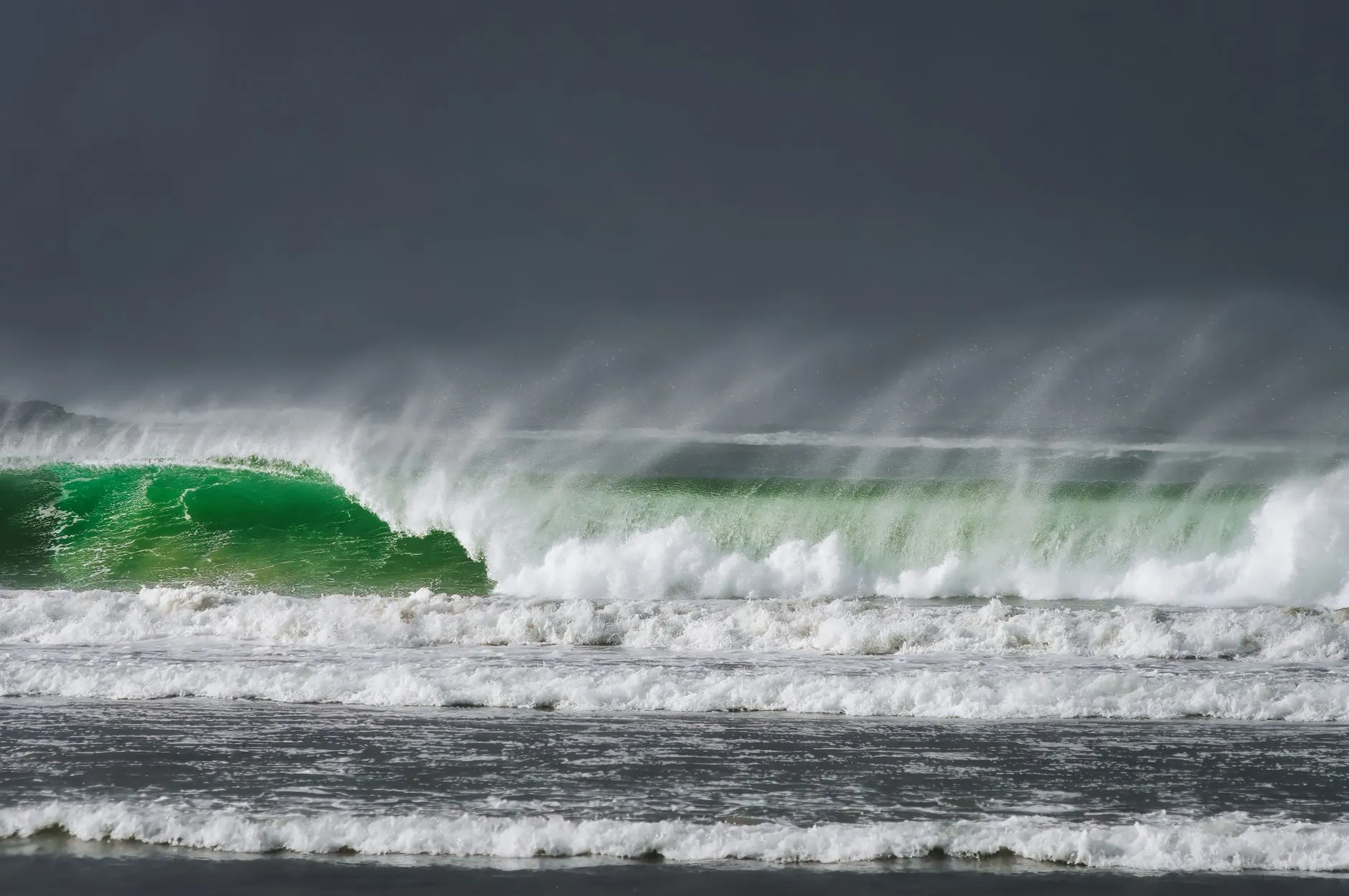 Offshore spray on a green Atlantic wall, west of Ireland