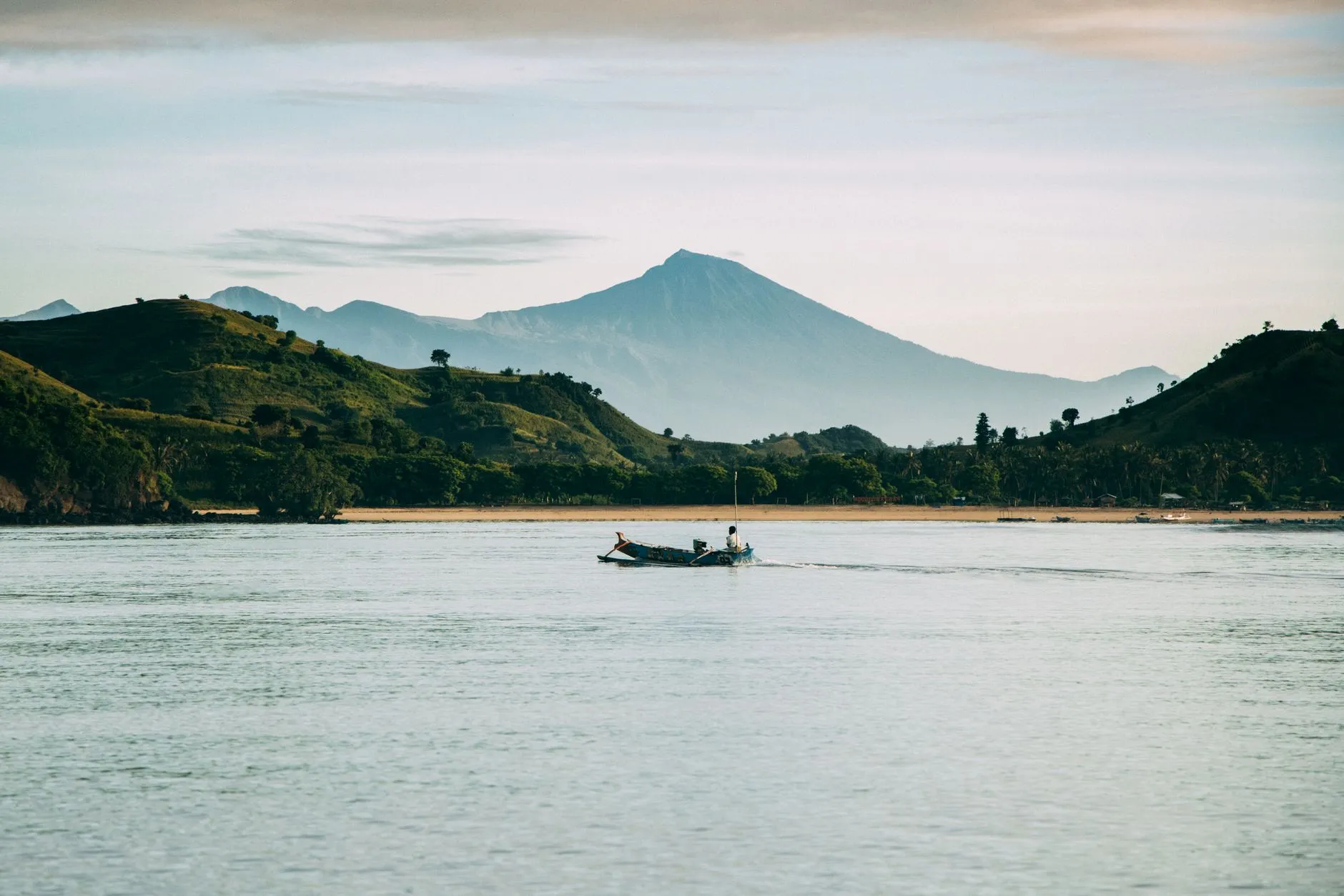 Glassy water and Rinjani on the horizon