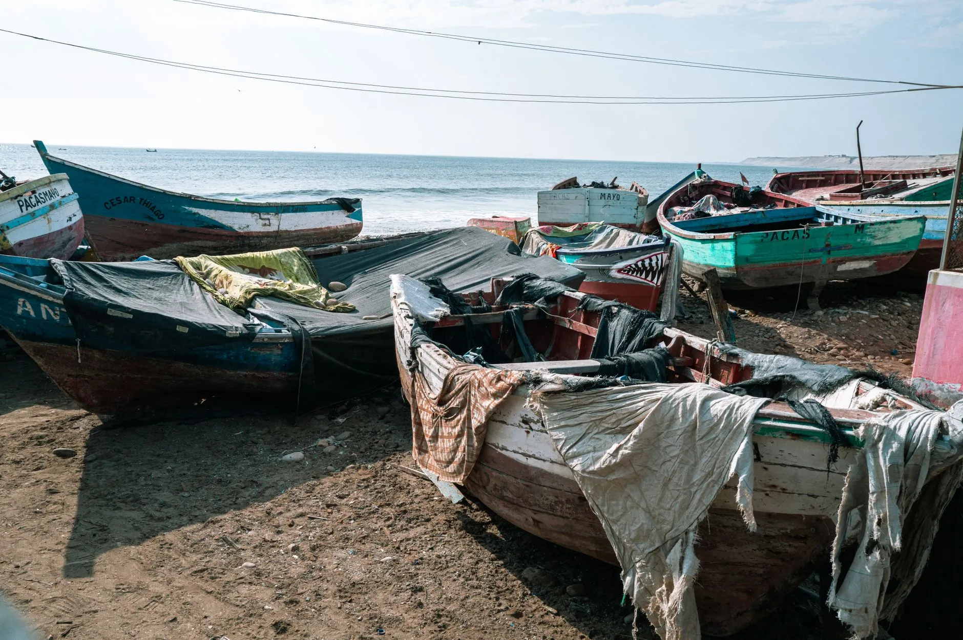 Working boats hauled out on the shore at Pacasmayo