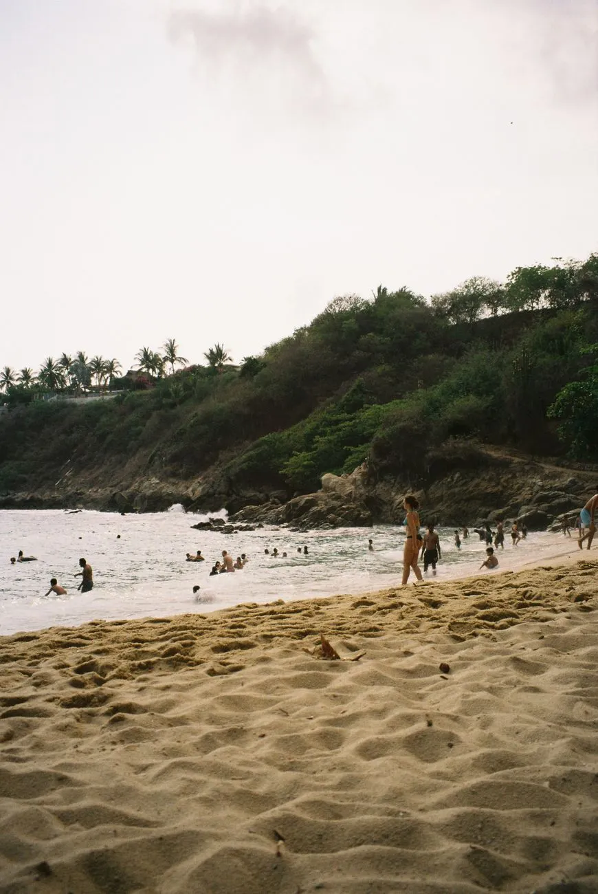 Swimmers and shade below the steps at Carrizalillo
